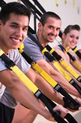 Students participate in the TRX wellness class at the Student Recreation Center